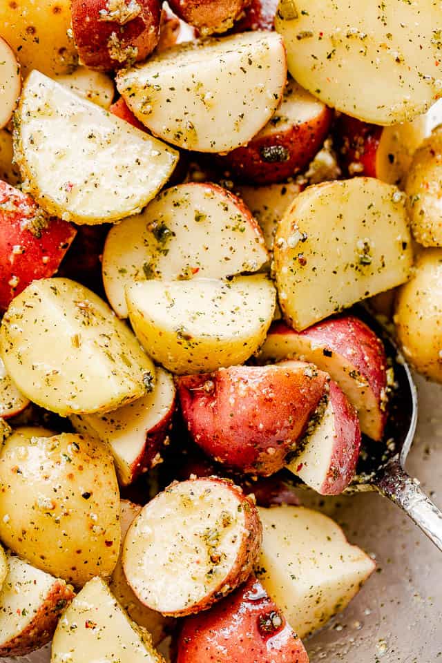 raw red baby potatoes cut in quarters and seasoned 