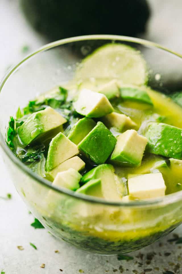 Avocado chimichurri sauce in a bowl topped with diced avocado.