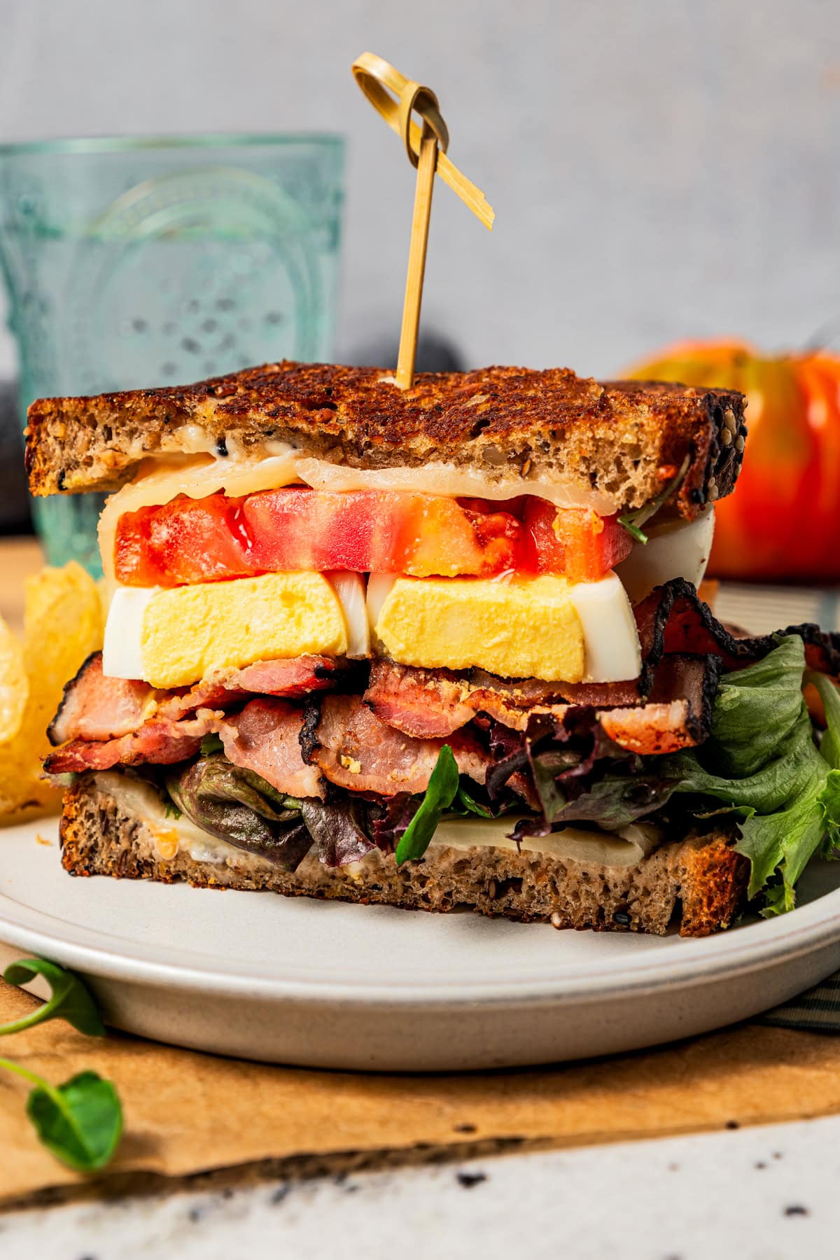 A bacon, egg, and cheese grilled cheese on a plate.