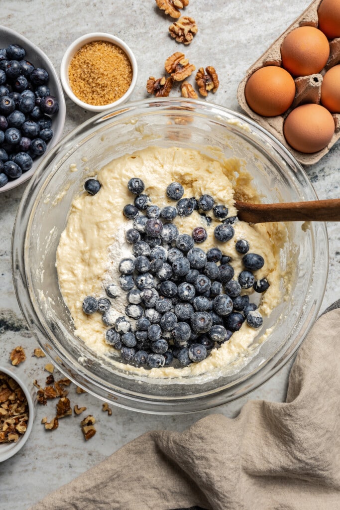 Folding the blueberries into the batter. 