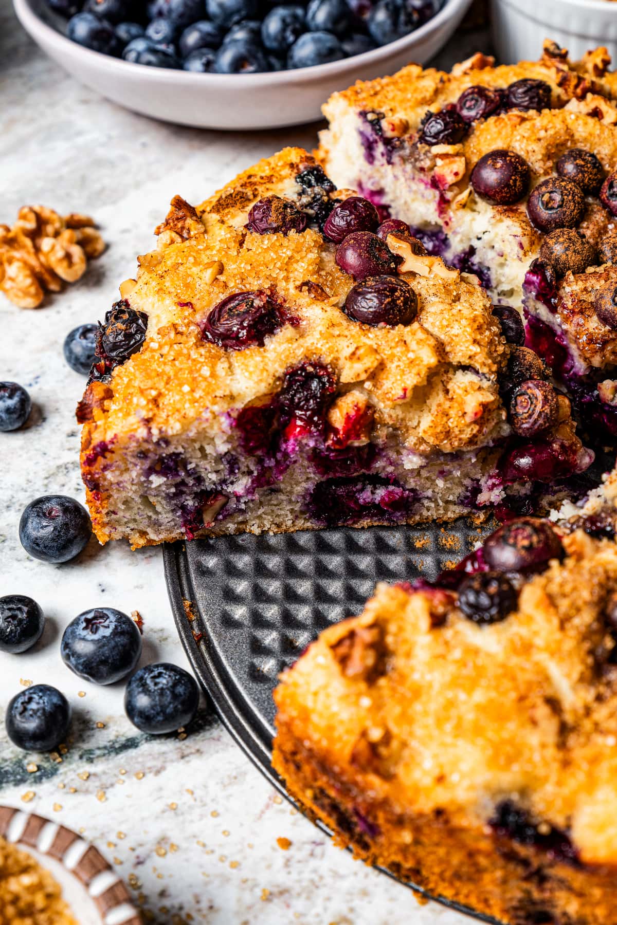 Baked blueberry cake cut into slices.