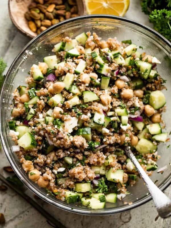 overhead shot of a glass mixing bowl with bulgur salad.