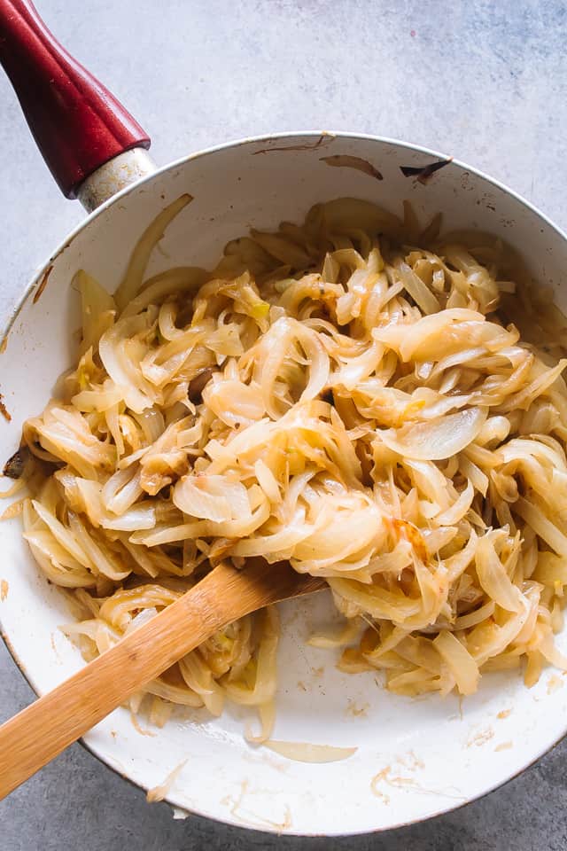 Cooking the onions on the stove.