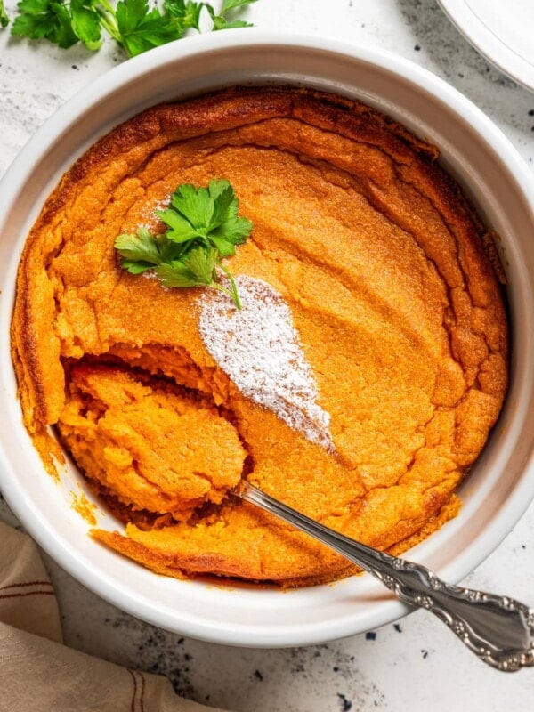 Overhead image of carrot souffle with a spoon in it.