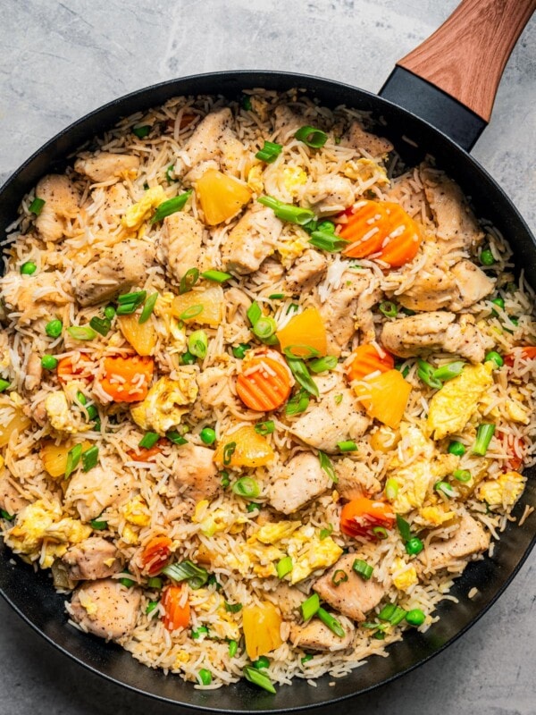 Chicken fried rice in a skillet.