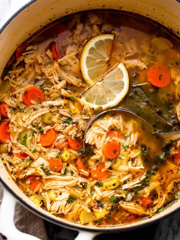 overhead shot of chicken orzo soup in a dutch oven