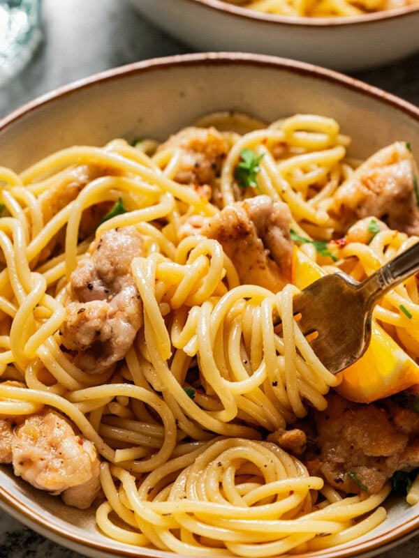 A fork twirling pasta.