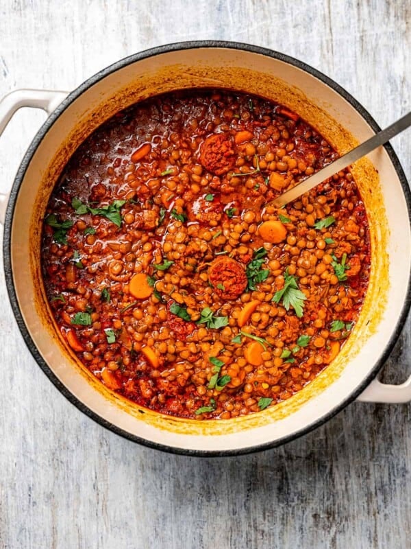 Lentil chorizo soup cooking in a heavy pot.