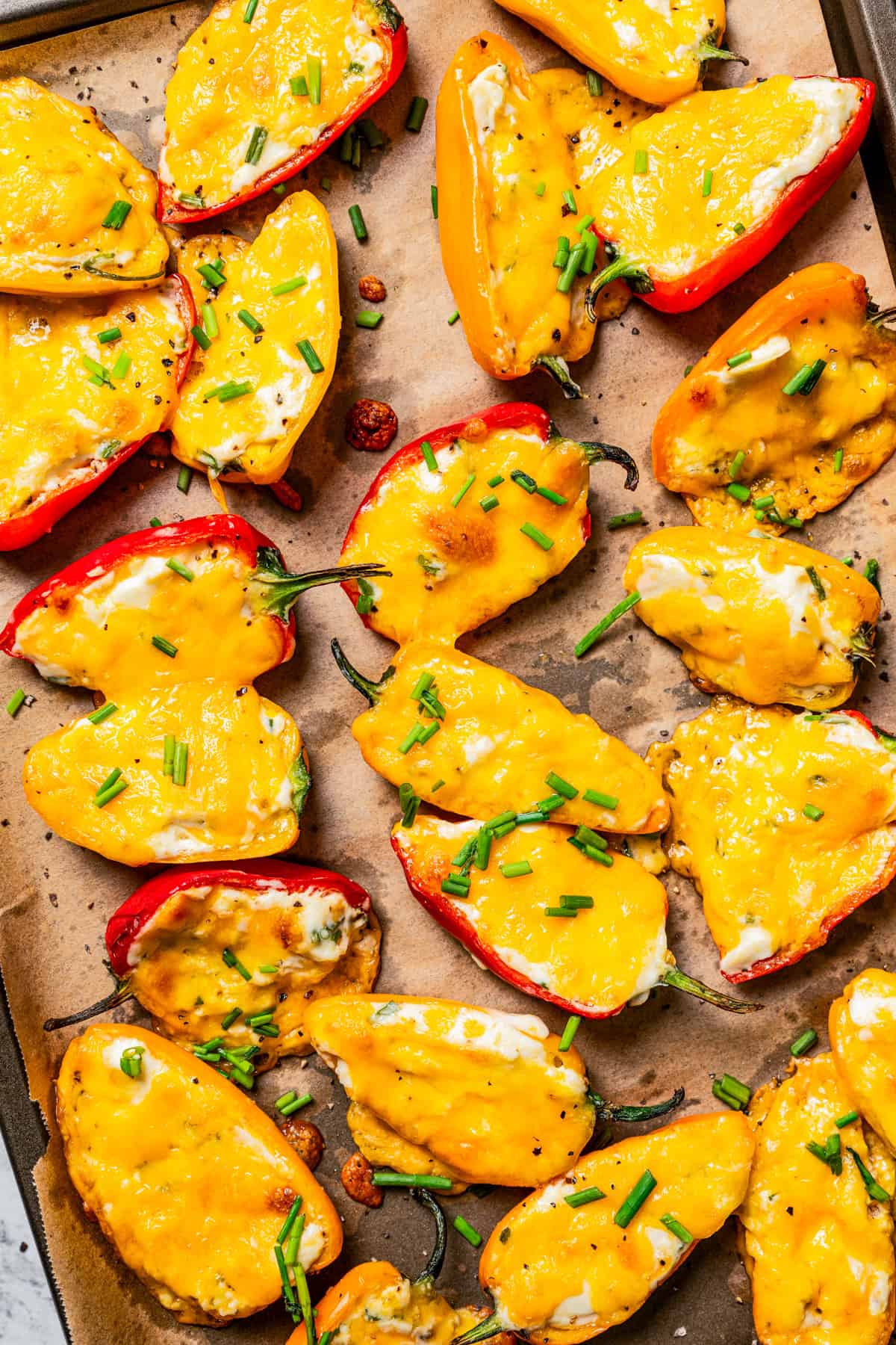 Mini stuffed peppers on a baking sheet.