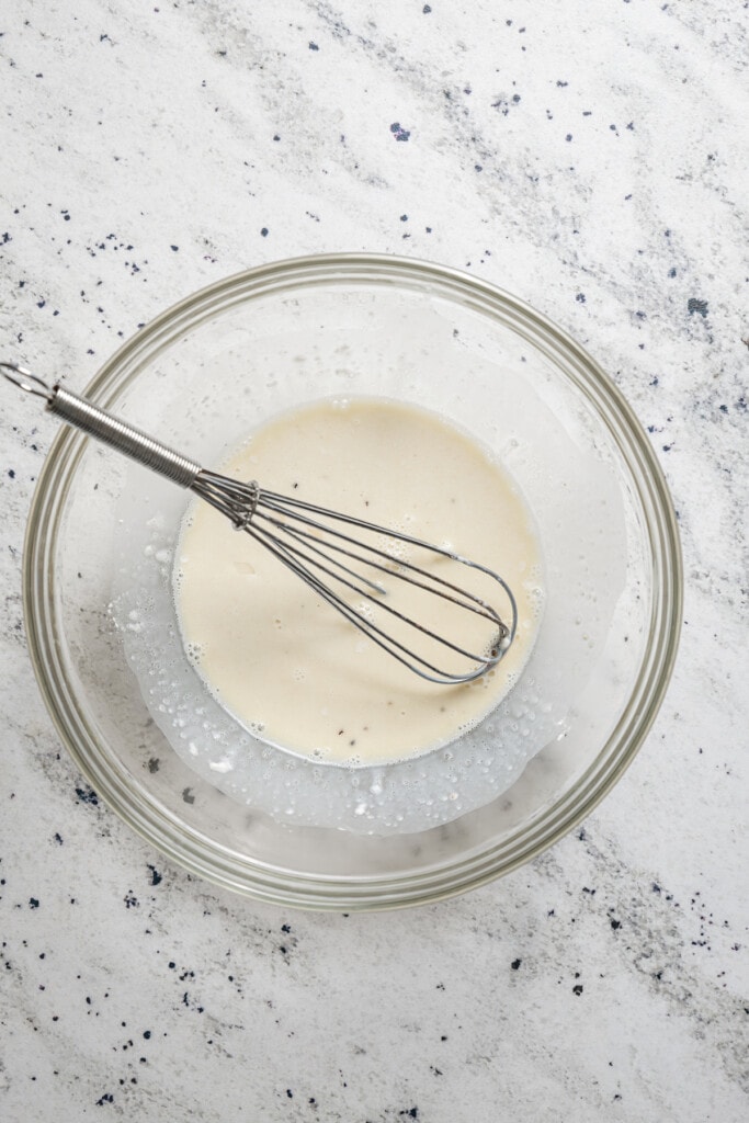 Whisking together milk and cornstarch.