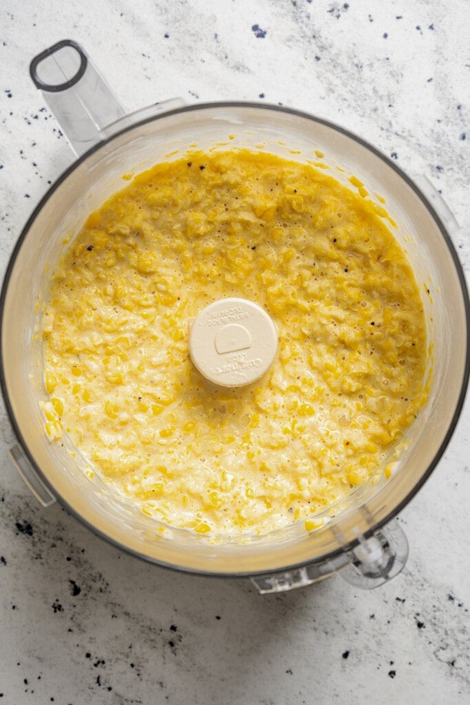 Pureed creamed corn in a food processor.