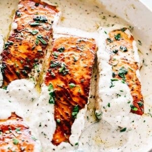 Pan Seared Salmon with Lemon Garlic Cream Sauce - Quick, delicious, bright and creamy salmon dinner prepared in just one skillet and served with an incredible lemon garlic cream sauce! All you need is about 20 minutes and a handful of ingredients.