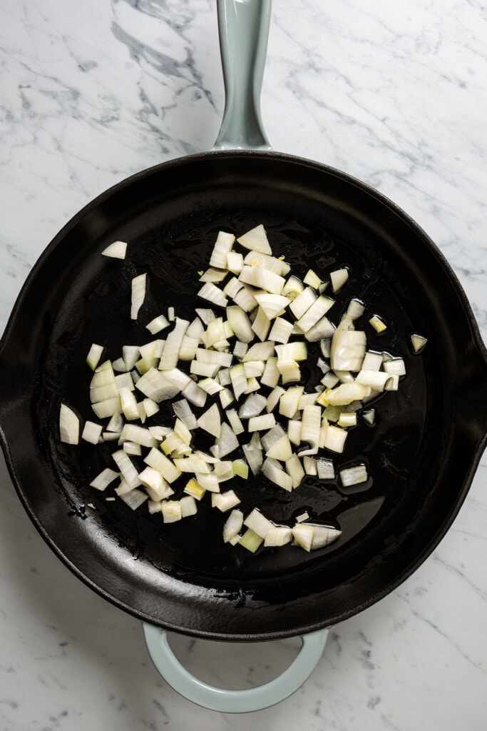 Sauteing onions in a skillet.