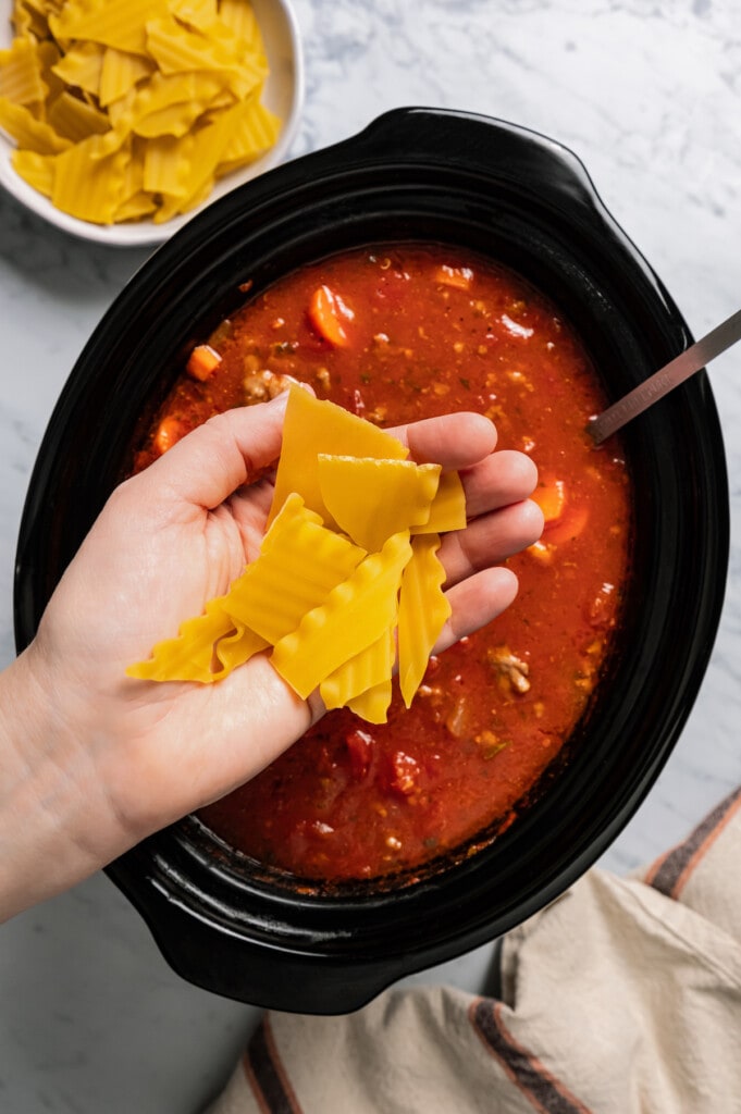 Adding lasagna noodles to tomato-y soup in a crockpot.