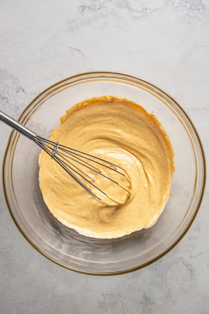 Whisking together the dressing for curry chicken salad.