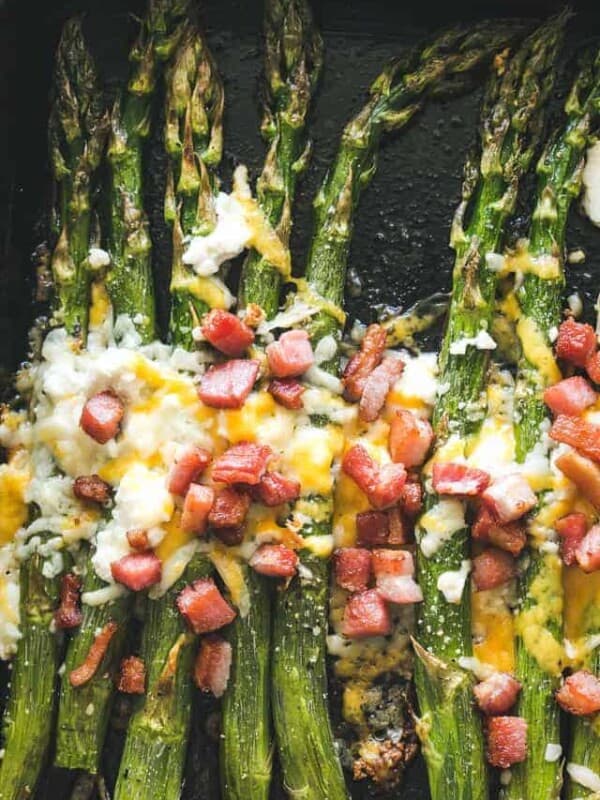 Garlic Roasted Asparagus with Bacon and Cheese - Our Garlic Roasted Asparagus is made with just a few simple ingredients, PLUS bacon and cheese,  and makes for a delicious side dish with any meal! 