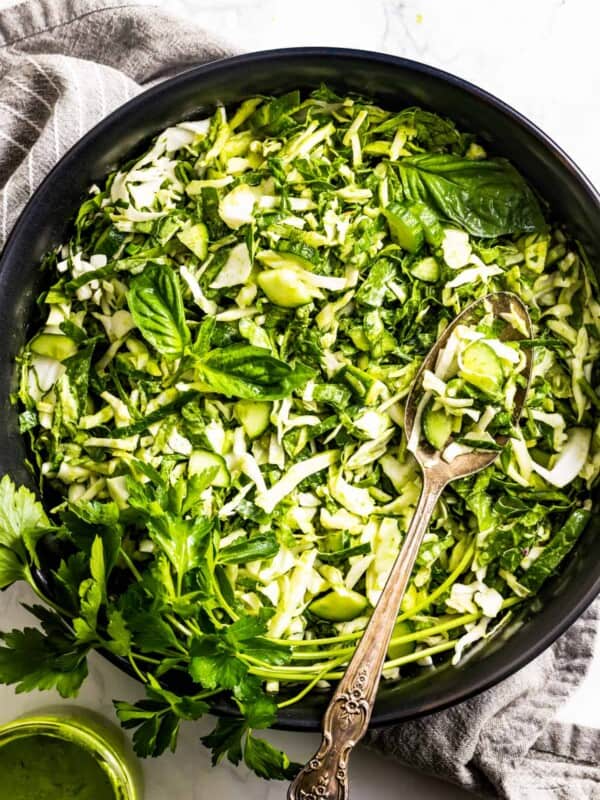 TikTok Green Goddess Salad in a bowl with dressing on the side.