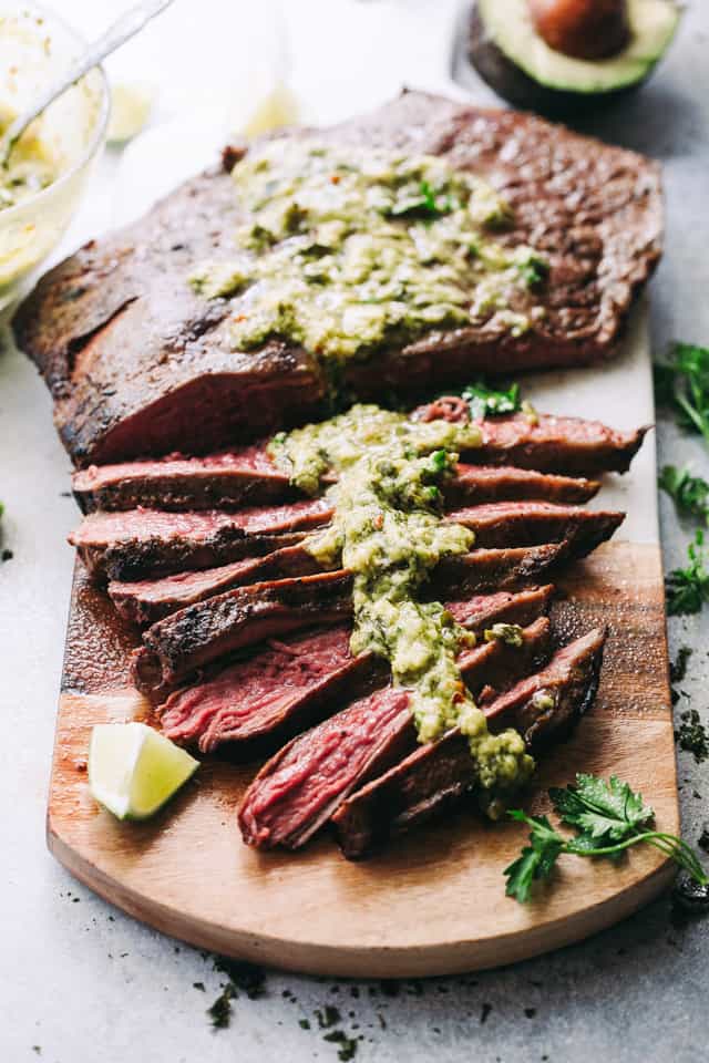 Chimichurri sauce served over grilled flank steak.