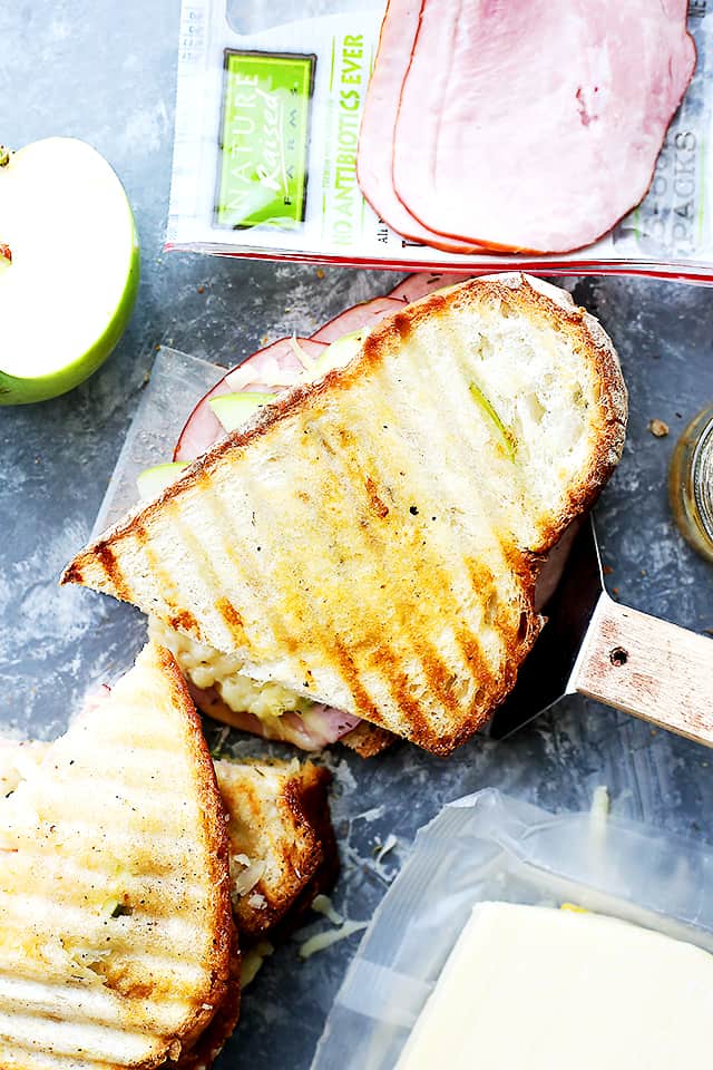 Transform the classic grilled cheese sandwich with a perfect combination of flavors and textures, including apples, ham, and gruyere cheese!