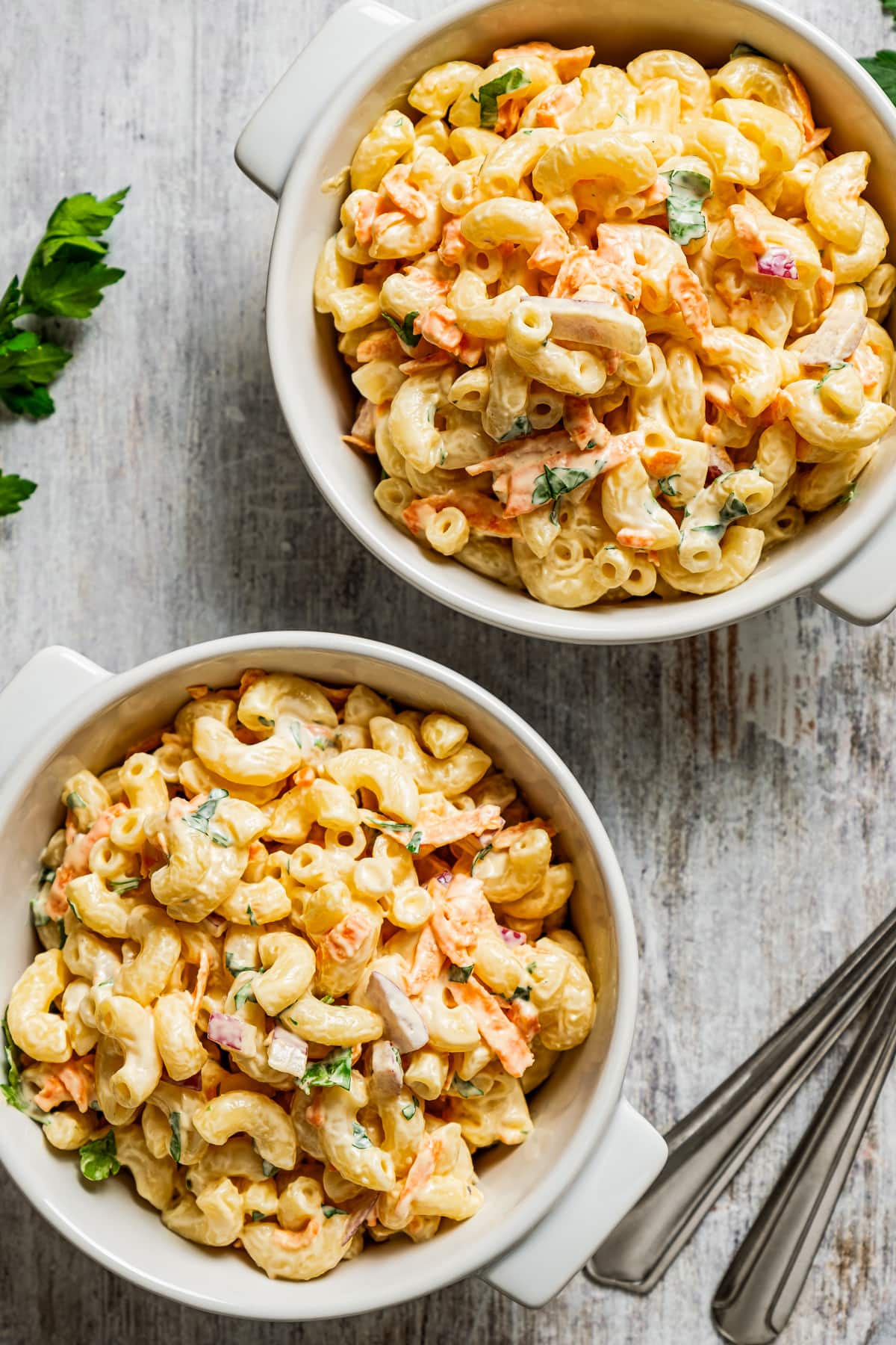 Hawaiian Macaroni Salad served in two small white bowls.