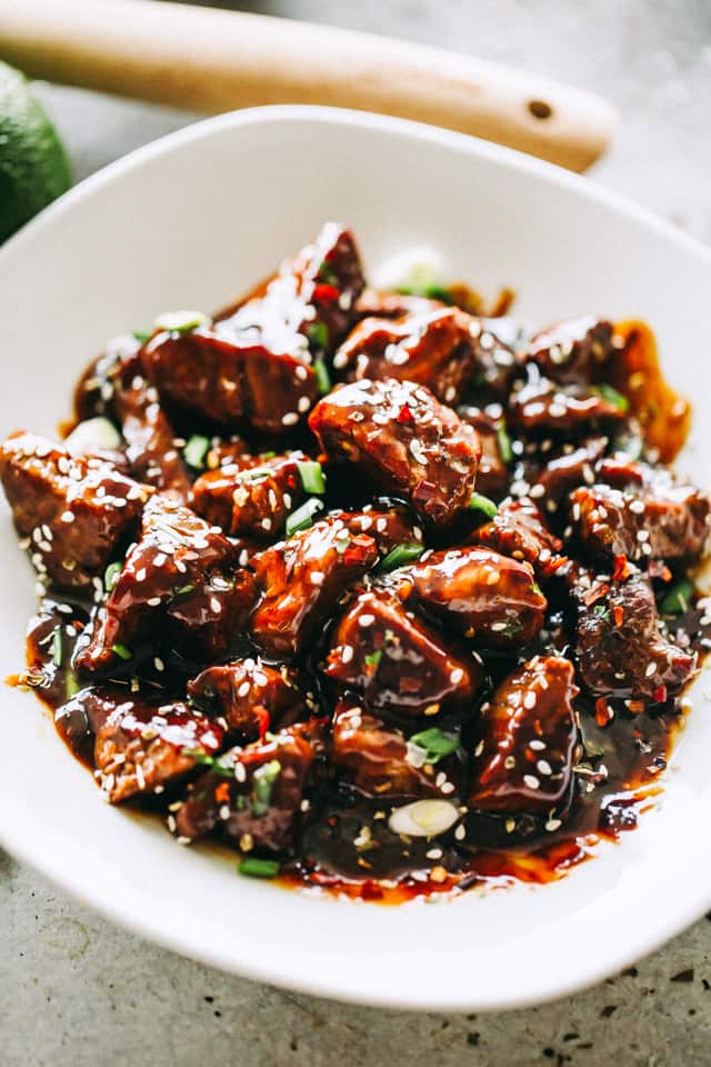 Honey Garlic Steak Bites served in a white bowl.