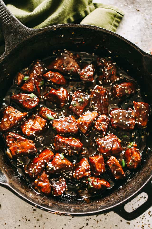 Cooking honey Garlic Steak Bites in a Skillet.