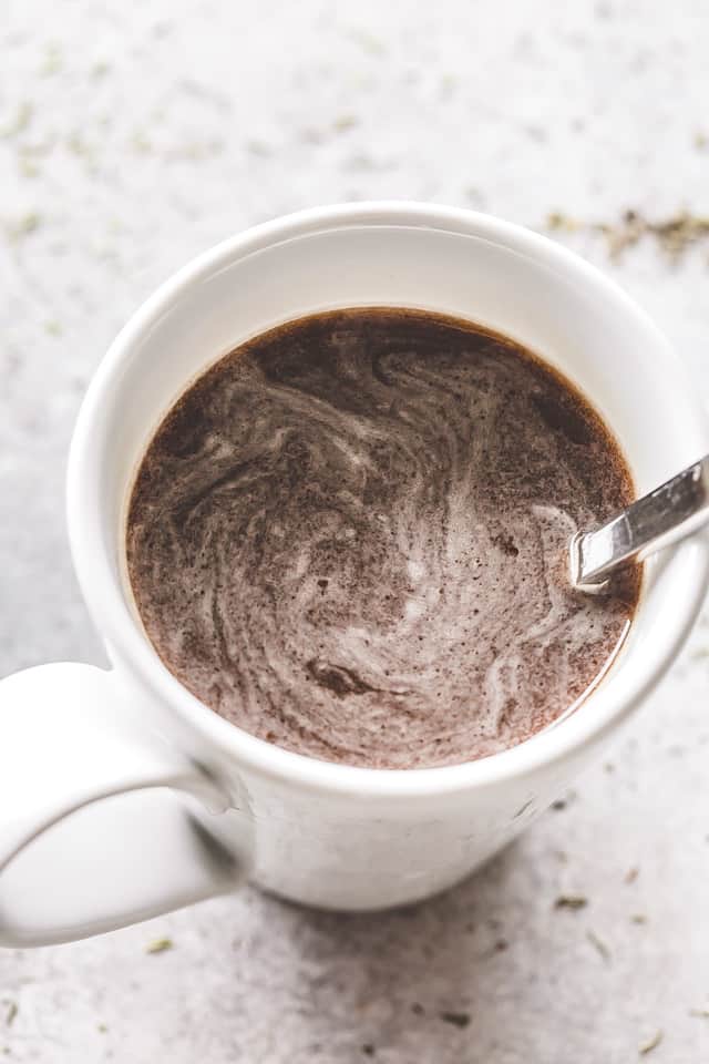 A white mug with espresso.