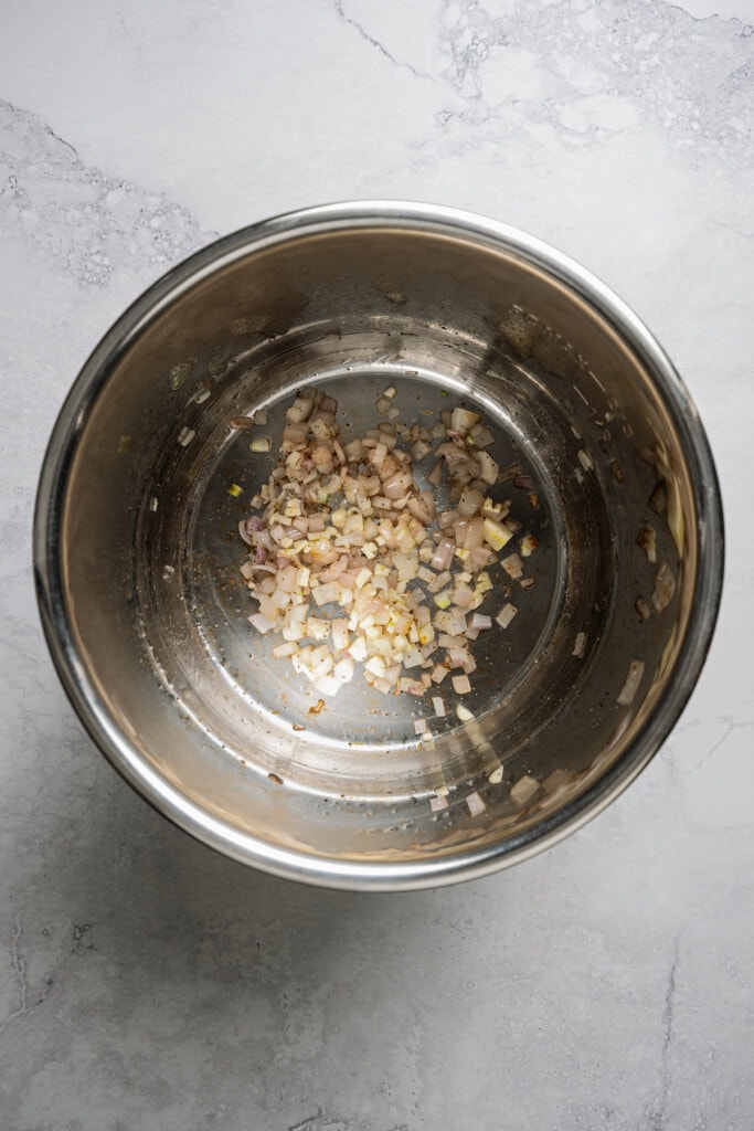 Sauteing shallots and garlic in an Instant Pot.