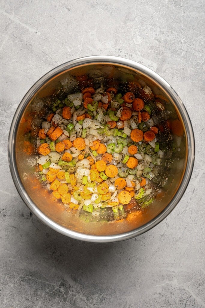 Sauteing onions, carrots, and celery in an Instant Pot.