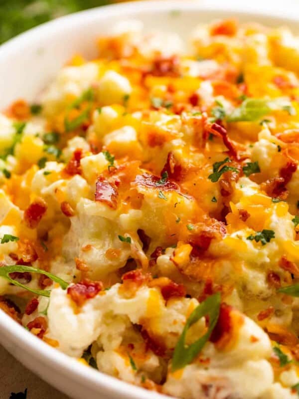 Loaded Cauliflower Salad in a white salad bowl