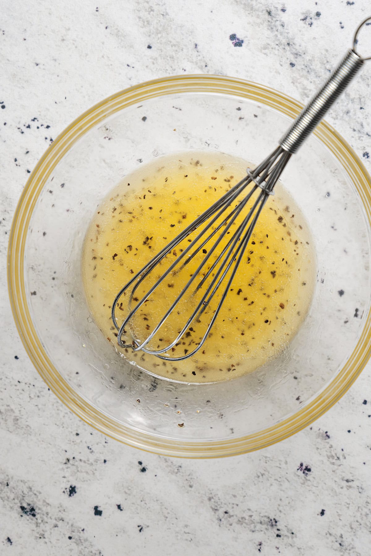 Whisking together a lemon salad dressing.