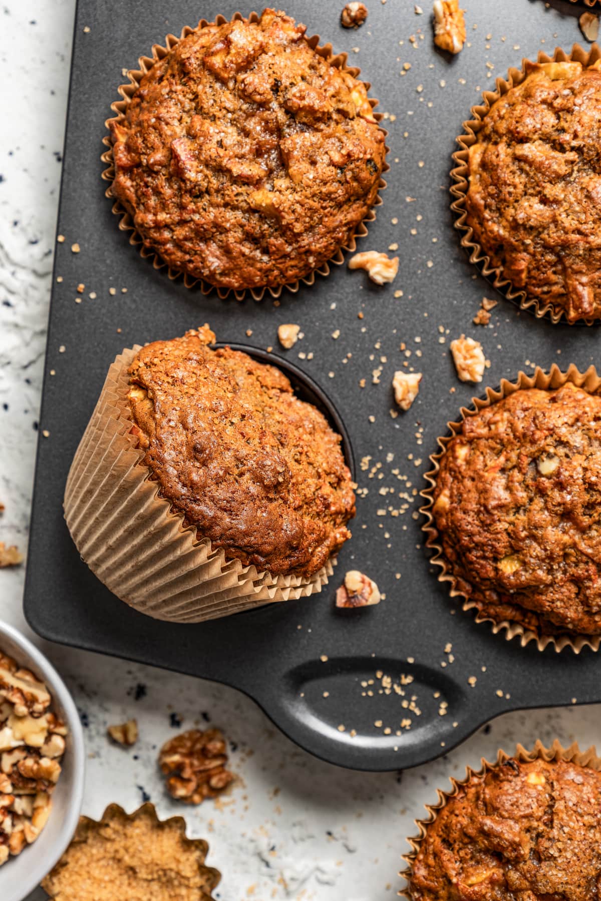 Overhead shot of a muffin pan with muffins.