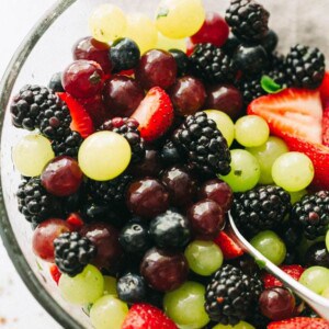 Moscato Fruit Salad - Prepared with colorful grapes and berries, this light, boozy, and delicious fresh fruit salad makes the perfect accompaniment to your summer nights!