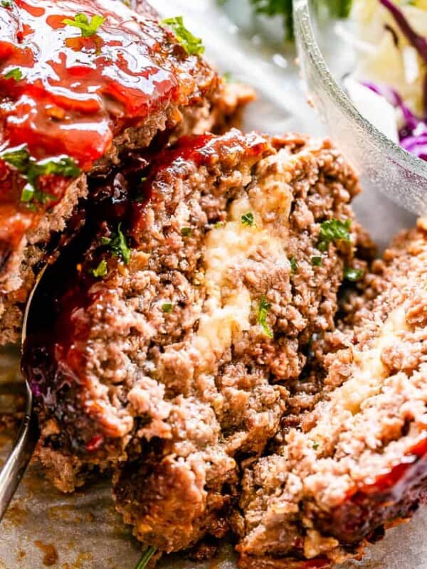 Slice of meatloaf stuffed with mozzarella cheese.