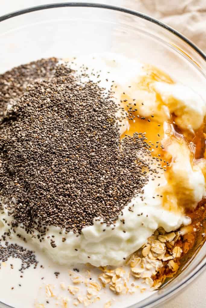 glass mixing bowl with ingredients for oatmeal