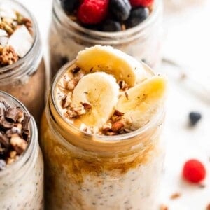 overnight oats in a jar garnished with peanut butter and sliced bananas