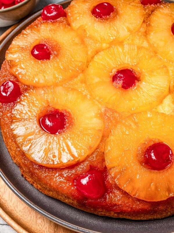 Close-up of a pineapple upside down cake on a plate.