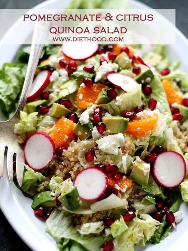 Pomegranate citrus quinoa salad with fresh fruit on a plate.