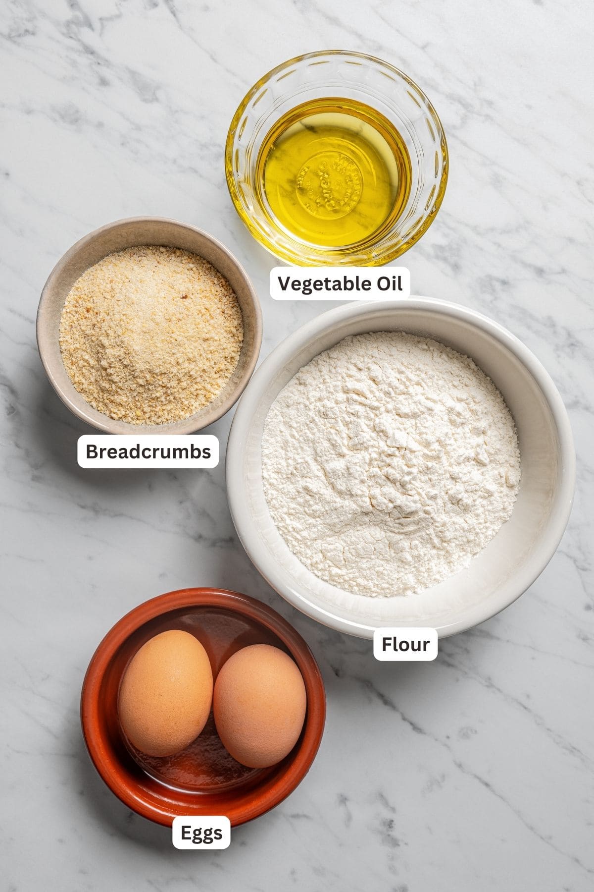 Labeled ingredients for dredging potato croquettes.