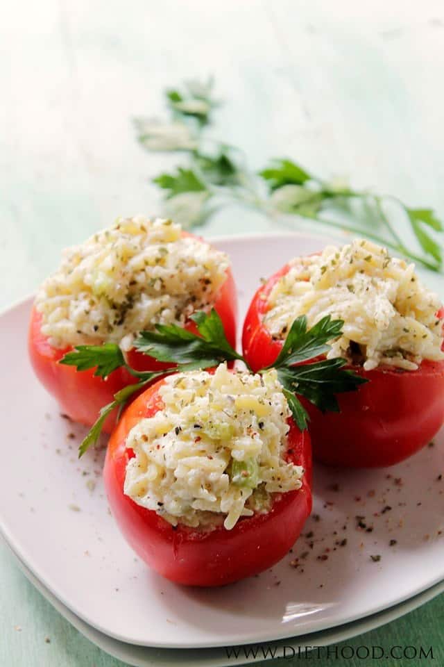 Ricotta and Orzo Stuffed Tomatoes served on a plate.