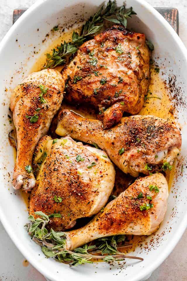 overhead shot of crispy baked chicken drumsticks and chicken thighs