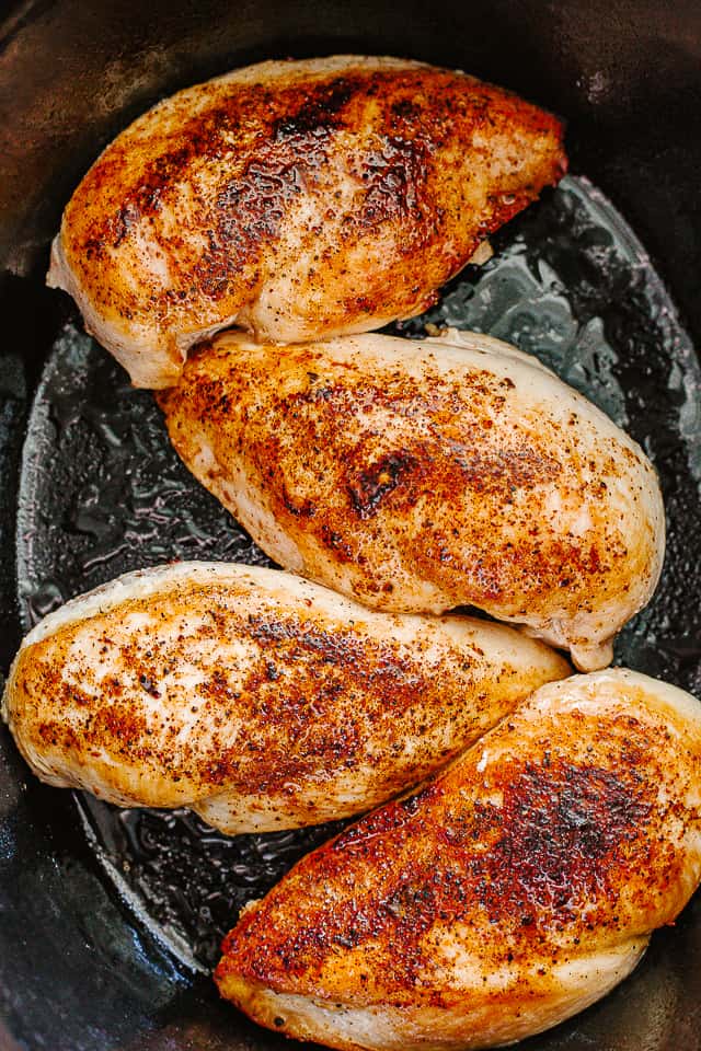 Browned chicken breasts in a slow cooker