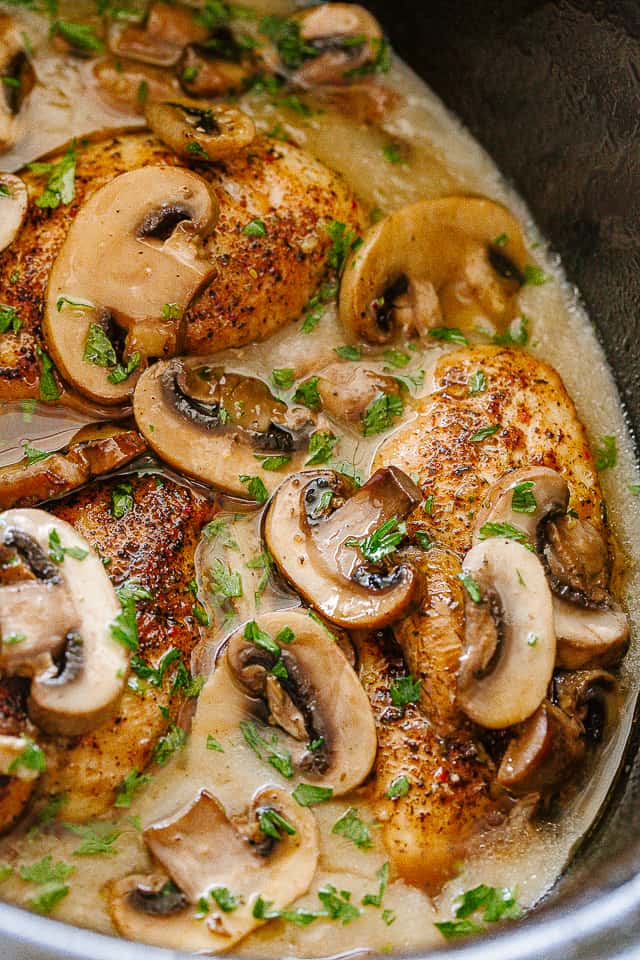 Cooked chicken marsala in a crock pot.