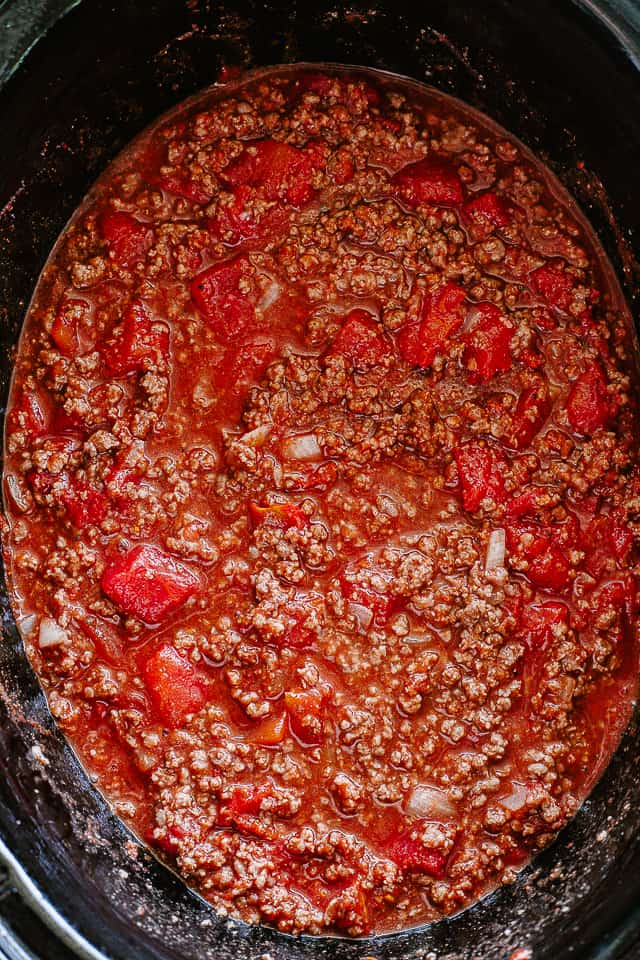 Cooking beef chili.