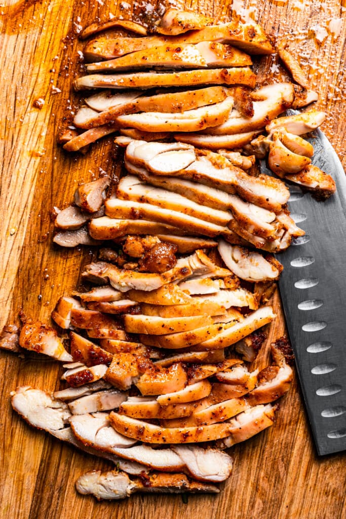 Slicing roasted Southwestern chicken thighs.