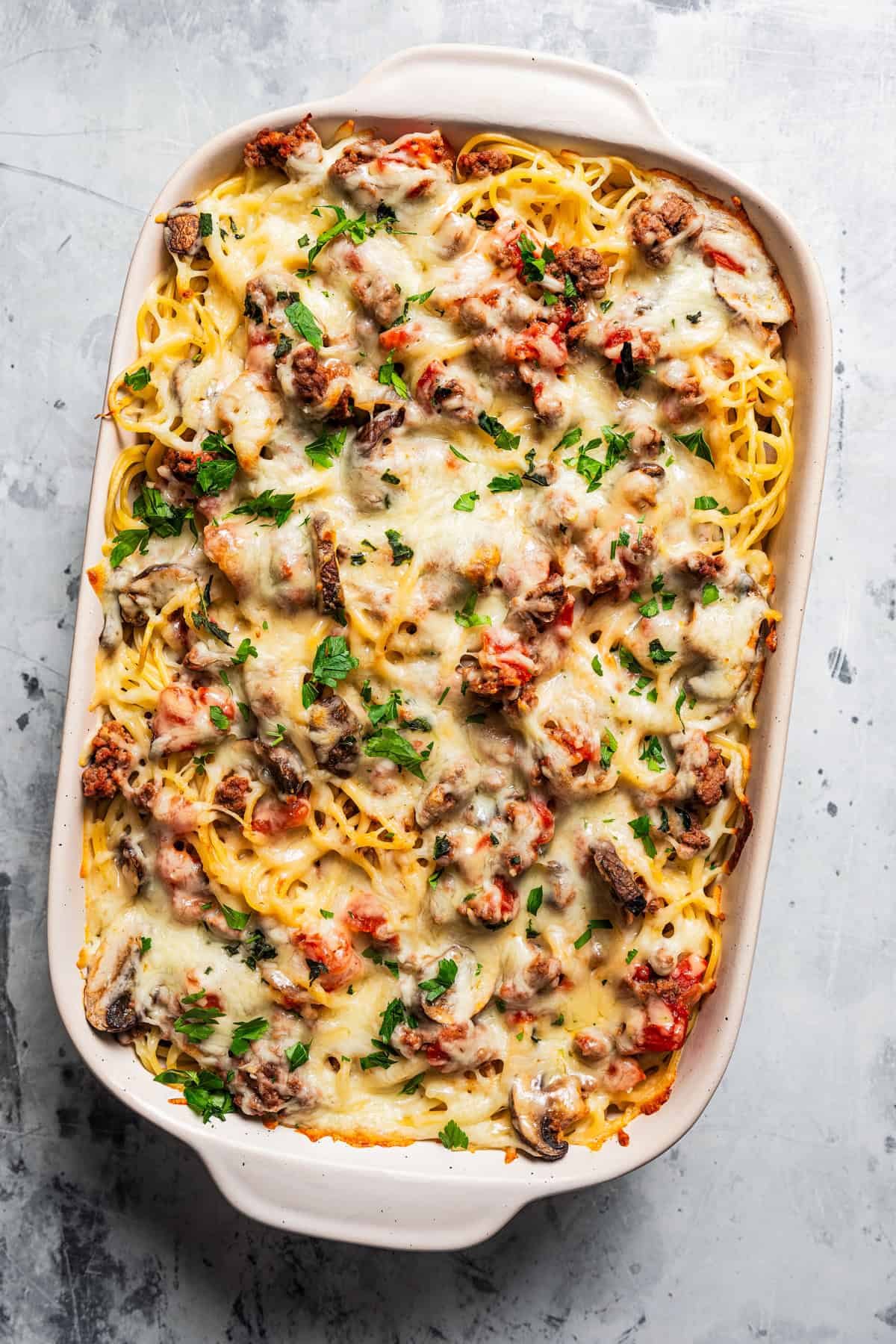 Baked spaghetti casserole in a baking dish.