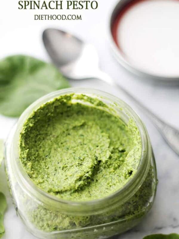 Creamy spinach pesto in a glass jar.