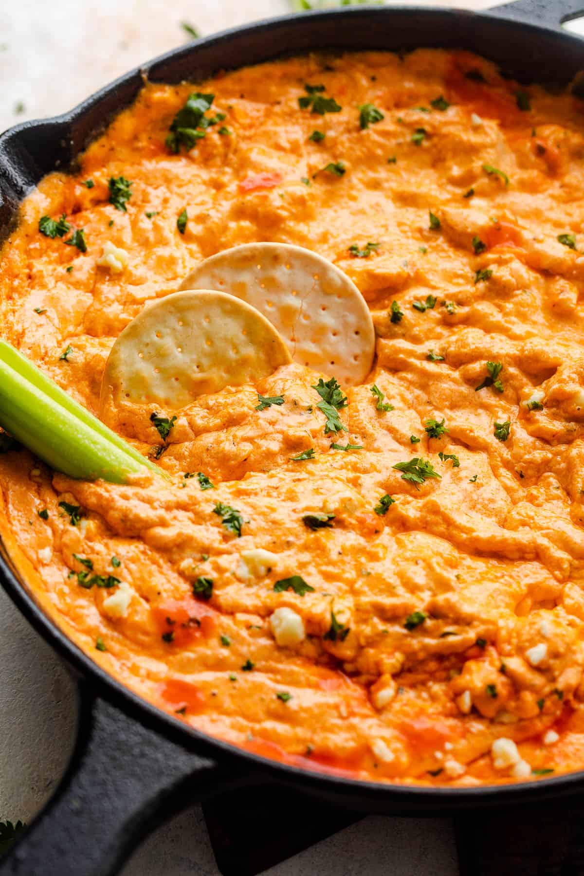 creamy buffalo dip sauce in a skillet