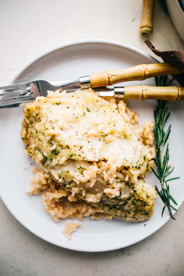 One Pan Risotto with Garlic Herb Tilapia – Delicious, garlicky tilapia set over a flavorful bed of rice, all baked to a creamy perfection!