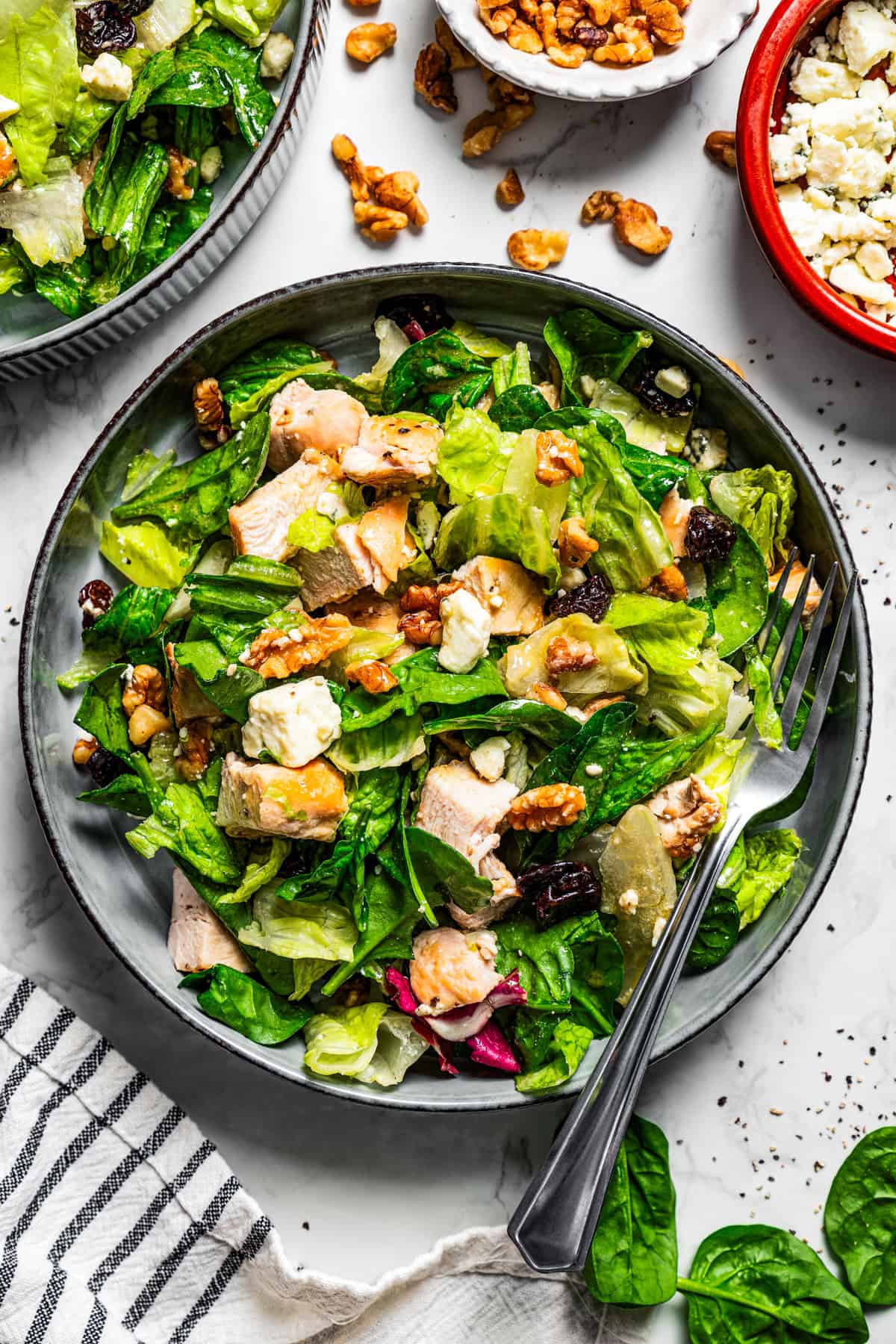 Overhead photo of walnut chicken salad served in a stoneware bowl.